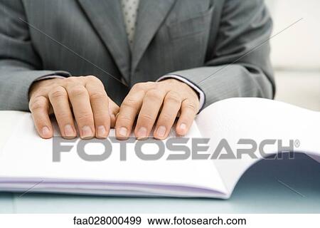 Professional man reading Braille, cropped view of hands View Large Photo Image Stock Photo - Professional man reading Braille, cropped view of hands. Fotosearch