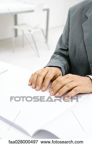 Professional man sitting at desk, reading Braille, cropped view of hands View Large Photo Image Stock Photo - Professional man sitting at desk, reading Braille, cropped view of hands. Fotosearch