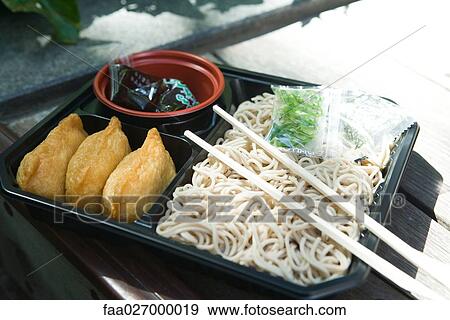 Ready-made inari sushi and noodles View Large Photo Image Stock Photo - Ready-made inari sushi and noodles. Fotosearch