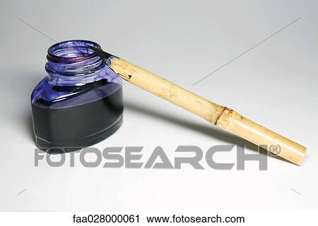 Reed pen and bottle of indigo ink, close-up View Large Photo Image Stock Image - Reed pen and bottle of indigo ink, close-up. Fotosearch