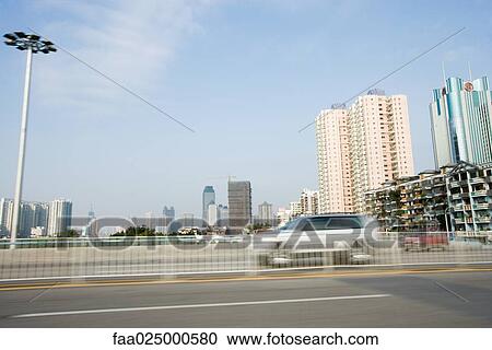 Road and cityscape, blurred motion View Large Photo Image Stock Image - Road and cityscape, blurred motion. Fotosearch