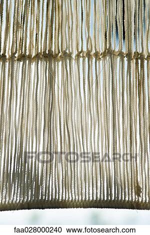 Rope fishing net hanging, close-up View Large Photo Image Stock Image - Rope fishing net hanging, close-up. Fotosearch