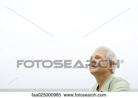 Senior man, ocean horizon in background View Large Photo Image Stock Photography - Senior man, ocean horizon in background. Fotosearch