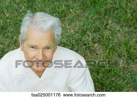 Senior man smiling up at camera, portrait View Large Photo Image Stock Photograph - Senior man smiling up at camera, portrait. Fotosearch