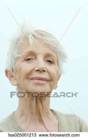 Senior woman smiling at camera, portrait View Large Photo Image Stock Image - Senior woman smiling at camera, portrait. Fotosearch