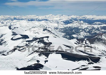 Snow-covered mountain range View Large Photo Image Stock Photo - Snow-covered mountain range. Fotosearch