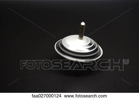Spinning top, close-up View Large Photo Image Picture - Spinning top, close-up. Fotosearch