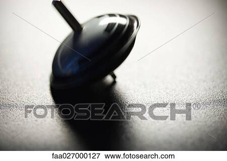 Spinning top, close-up View Large Photo Image Stock Photo - Spinning top, close-up. Fotosearch
