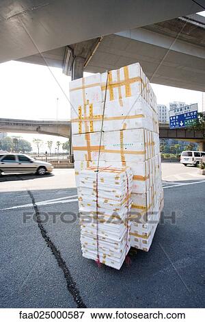 Stack of polystyrene boxes on asphalt View Large Photo Image Stock Photo - Stack of polystyrene boxes on asphalt. Fotosearch