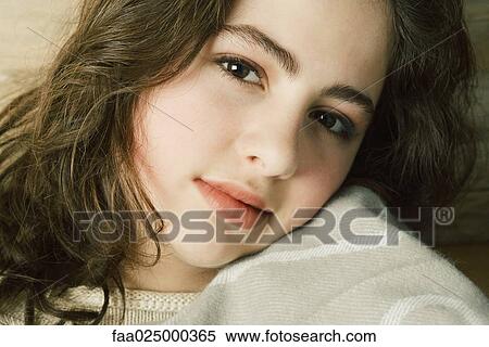 Teen girl, resting cheek on blanket, portrait View Large Photo Image Stock Photography - Teen girl, resting cheek on blanket, portrait. Fotosearch