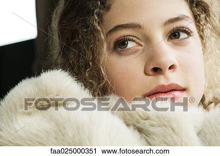 Teen girl under soft blanket, close-up View Large Photo Image Stock Image - Teen girl under soft blanket, close-up. Fotosearch