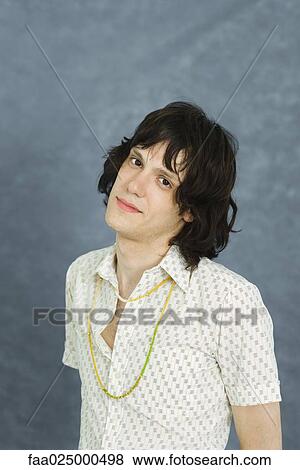 Teenage boy looking at camera, head tilted, portrait View Large Photo Image Stock Photo - Teenage boy looking at camera, head tilted, portrait. Fotosearch