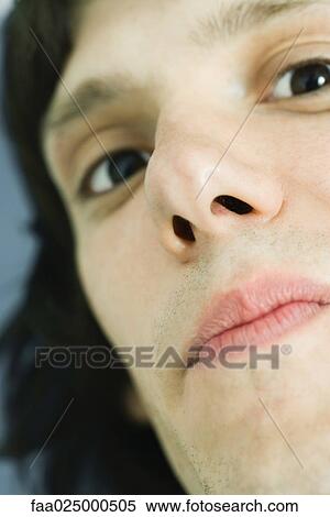 Teenage boy with head tilted, looking at camera, extreme close-up View Large Photo Image Stock Photography - Teenage boy with head tilted, looking at camera, extreme close-up. Fotosearch