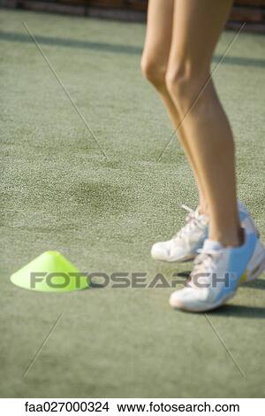 Teenage girl jumping, low angle view, cropped View Large Photo Image Picture - Teenage girl jumping, low angle view, cropped. Fotosearch