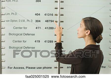 teenage girl, number, wall, pointing, looking up, last name, building directory View Large Photo Image Stock Photography - teenage girl, number, wall, pointing, looking up, last name, building directory. Fotosearch