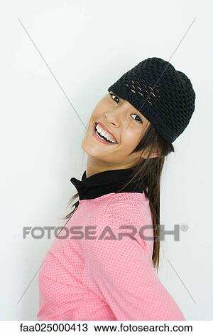 Teenage girl smiling at camera, portrait, side view View Large Photo Image Stock Image - Teenage girl smiling at camera, portrait, side view. Fotosearch