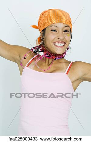 Teenage girl wearing bandana, smiling at camera View Large Photo Image Stock Image - Teenage girl wearing bandana, smiling at camera. Fotosearch