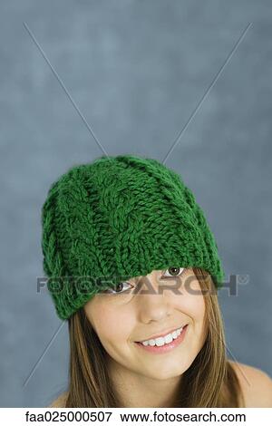 Teenage girl wearing knit hat, portrait View Large Photo Image Stock Photo - Teenage girl wearing knit hat, portrait. Fotosearch