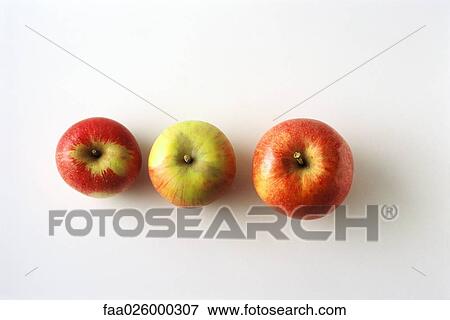 Three apples in a row, high angle view View Large Photo Image Stock Photo - Three apples in a row, high angle view. Fotosearch