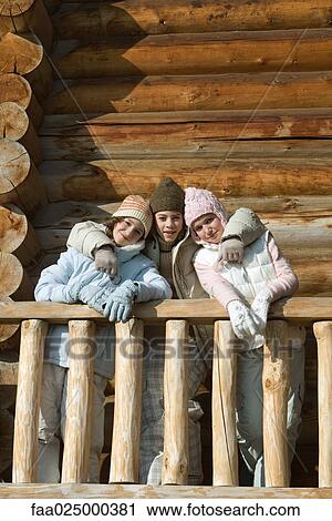 Three preteen or teen girls standing on deck of log cabin, smiling at camera View Large Photo Image Stock Image - Three preteen or teen girls standing on deck of log cabin, smiling at camera. Fotosearch
