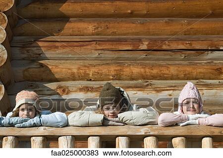 Three preteen or teen girls standing on deck of log cabin, resting heads on hands View Large Photo Image Stock Image - Three preteen or teen girls standing on deck of log cabin, resting heads on hands. Fotosearch