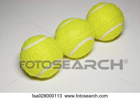 Three tennis balls in a row, close-up View Large Photo Image Stock Image - Three tennis balls in a row, close-up. Fotosearch