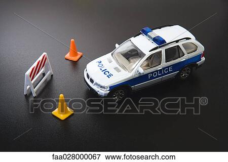 Toy police car and traffic cones, close-up View Large Photo Image Stock Photo - Toy police car and traffic cones, close-up. Fotosearch