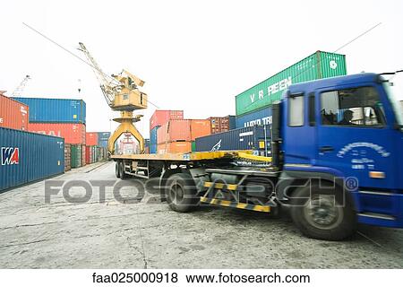 Truck driving through cargo containers View Large Photo Image Stock Photo - Truck driving through cargo containers. Fotosearch