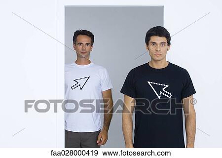 Two men wearing tee-shirts printed with computer cursors View Large Photo Image Stock Photo - Two men wearing tee-shirts printed with computer cursors. Fotosearch