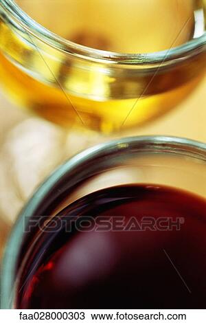 Two wine glasses with red and white wines, high angle view, cropped View Large Photo Image Stock Image - Two wine glasses with red and white wines, high angle view, cropped. Fotosearch