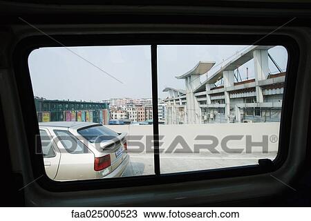 Urban scene viewed from car window View Large Photo Image Stock Image - Urban scene viewed from car window. Fotosearch