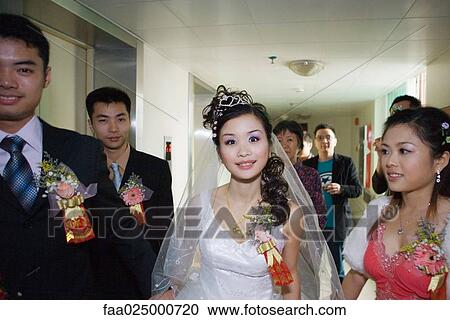 Wedding procession moving through hallway View Large Photo Image Stock Image - Wedding procession moving through hallway. Fotosearch