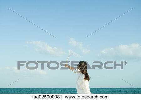 Woman catching clouds with butterfly net View Large Photo Image Stock Image - Woman catching clouds with butterfly net. Fotosearch