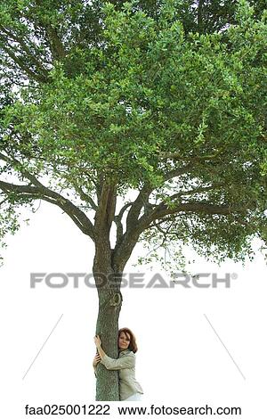 Woman hugging tree View Large Photo Image Stock Image - Woman hugging tree. Fotosearch