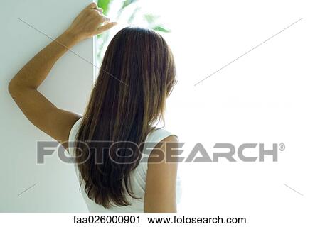 Woman looking out window, rear view, close-up View Large Photo Image Stock Image - Woman looking out window, rear view, close-up. Fotosearch