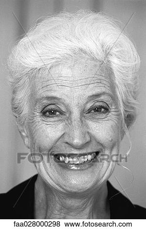 Woman smiling at camera, portrait View Large Photo Image Stock Photo - Woman smiling at camera, portrait. Fotosearch
