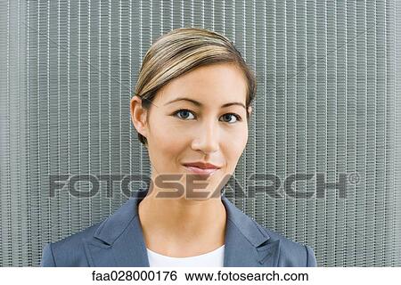 Woman smiling at camera, portrait View Large Photo Image Stock Photograph - Woman smiling at camera, portrait. Fotosearch