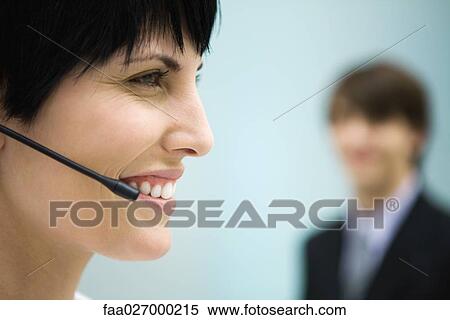 Woman using headset, profile, close-up View Large Photo Image Stock Photography - Woman using headset, profile, close-up. Fotosearch