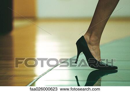 Woman walking in high heels, cropped view of foot View Large Photo Image Stock Image - Woman walking in high heels, cropped view of foot. Fotosearch