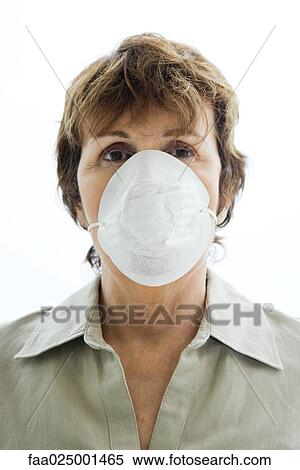 Stock Photography - Woman wearing pollution mask, portrait. Fotosearch