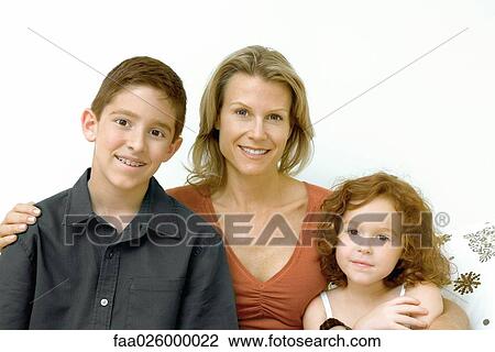 Woman with son and daughter smiling at camera, portrait View Large Photo Image Stock Image - Woman with son and daughter smiling at camera, portrait. Fotosearch