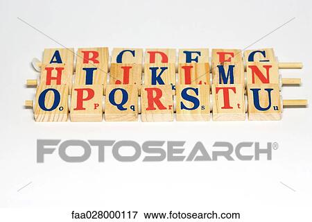 Wooden alphabet blocks lined up, close-up View Large Photo Image Stock Photo - Wooden alphabet blocks lined up, close-up. Fotosearch