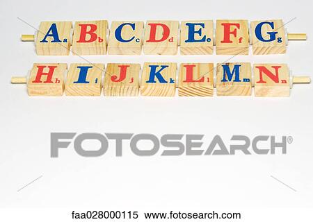Wooden alphabet blocks lined up, close-up View Large Photo Image Stock Photography - Wooden alphabet blocks lined up, close-up. Fotosearch