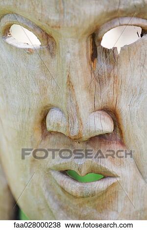 Wooden face mask, close-up View Large Photo Image Stock Photo - Wooden face mask, close-up. Fotosearch