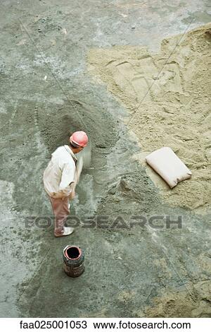 Worker at construction site, high angle view View Large Photo Image Stock Image - Worker at construction site, high angle view. Fotosearch