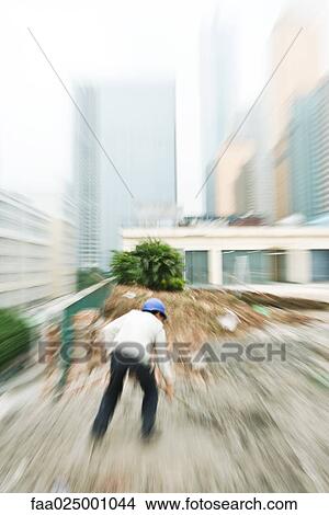 Picture - Worker in construction site. Fotosearch