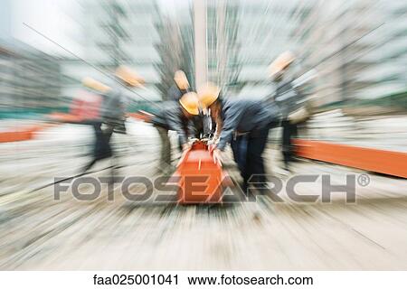 Workers at construction site, blurred motion View Large Photo Image Stock Image - Workers at construction site, blurred motion. Fotosearch