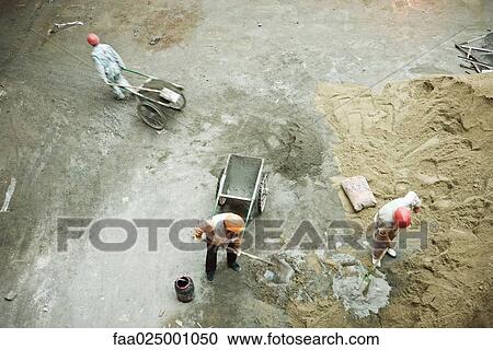Workers at construction site, high angle view View Large Photo Image Stock Image - Workers at construction site, high angle view. Fotosearch