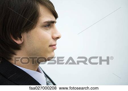 Young man looking away, profile, portrait View Large Photo Image Stock Photo - Young man looking away, profile, portrait. Fotosearch