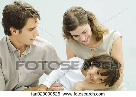 Young parents with little boy View Large Photo Image Stock Photograph - Young parents with little boy. Fotosearch